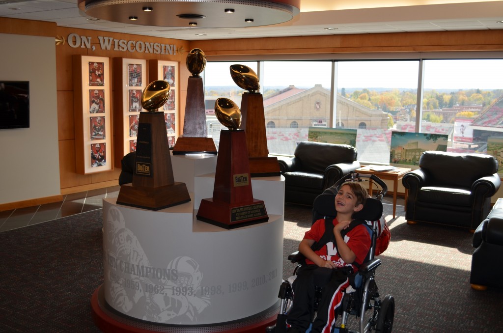 Kaden and the Big 10 Championship trophies.